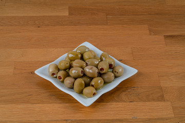 Olives assortment in bowl with oil. 