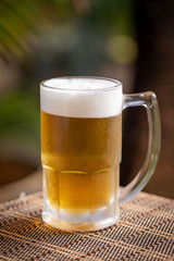 mug of beer on wooden table