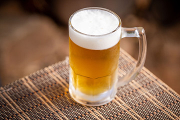 glass of beer on wooden table