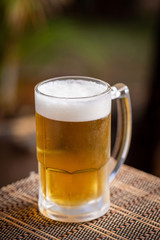 glass of beer on wooden table