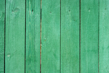 Naklejka premium Background image of a green painted wooden fence texture