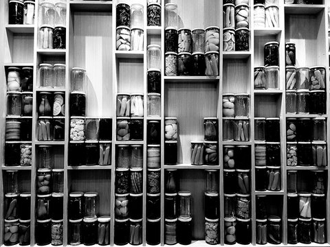 Various Preserves In Jars On Shelf