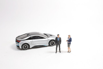 a mini of Business figure and toy car.