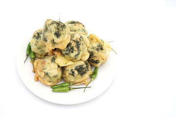 Round fried snack from Indonesia called "Rolade" made from cassava leaves and mashed tofu