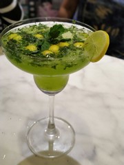 green cocktail with lime