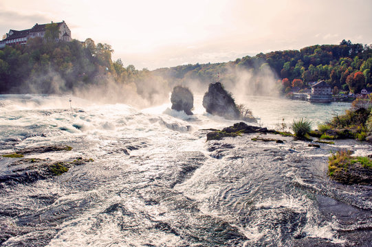 Mighty white rapids of the Rhine River at the Rhine Falls, the famous and biggest waterfall in Europe located in Schaffhausen, Switzerland