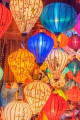 Fototapeta na wymiar Paper lanterns on the streets of old Asian town, Hoi An, Vietnam
