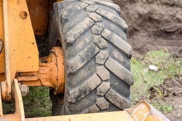 The modern excavator performs excavation work on the construction site