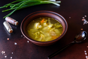 Fresh vegan soup with broccoli, cauliflower, asparagus and carrots
