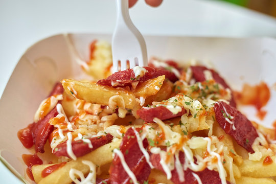 Eating French Fries and Salchipapas