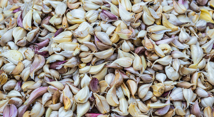 Close up cloves of garlic in local market