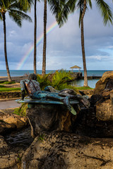 Waikiki Beach Hawaii opening day of the COVID pandemic. Few people, lone fisherman, diamond head,...