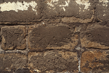 Fallen plaster on house wall background