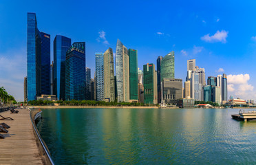 Fototapeta na wymiar Panoramic view of skyscapers of the Singapore city business district skyline at Marina Bay of downtown in daytime