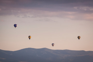 Aerostatic balloon festival over the city of Segovia, Castilla y León. Spain. Adventures with friends and family, flights. Flying at sunrise in a balloon