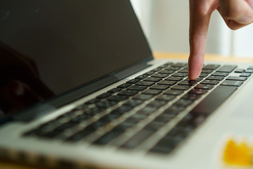 One finger press enter button with close up shot