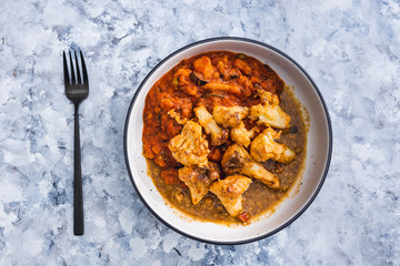 plant-based food, aubergine and tomato bake with air fried vegan buffalo cauliflower