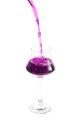 pouring cocktail in glass on white background