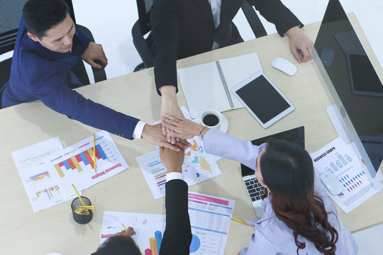 Group of business people team have meeting and talking and brainstorming and stack hands teamwork in a conference room