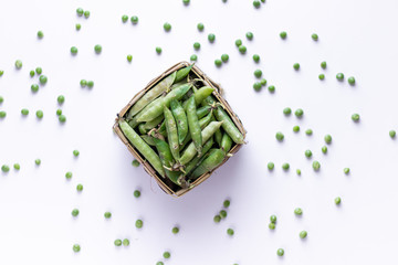 Healthy fresh green peas top view flat lay with white background. 