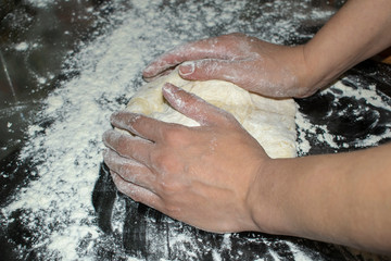 Fototapeta premium The process of preparing the Caucasian delicacy khachapuri.
