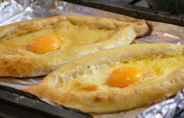 The process of preparing the Caucasian delicacy khachapuri.