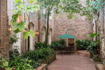 Fototapeta na wymiar Patio with brick walls and greenery