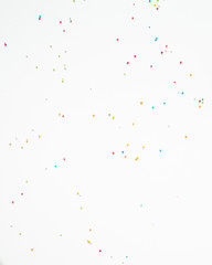 Colourful Sugar sprinkles, decoration for cake, ice-cream and cookies. Top view, Flat lay on white background. Copy space.
