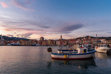 Fototapeta premium Ancient harbour with fishing boats of Imperia Oneglia in evening, Italy