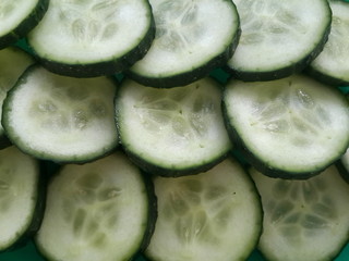 cucumber slices on a green platter