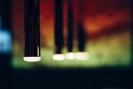 Close-up Of Illuminated Electric Lamps In Dark