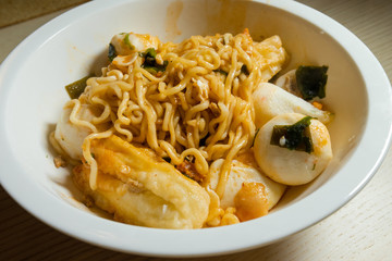 A bowl of spicy stir fried noodle.