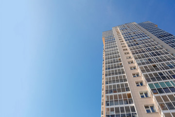 Obraz premium New tall house on a background of blue sky