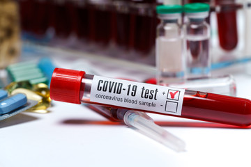 Naklejka premium blood test tubes and packings of pills and capsules of medicine