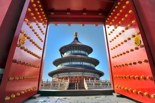 Traditional red entrance gate and the Temple of heaven in Beijing - China