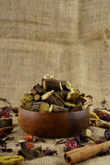 Licorice or liquorice root sticks isolated on dark or textille background stock photo