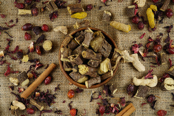 Licorice or liquorice root sticks isolated on dark or textille background stock photo