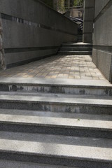 old narrow stone stairs between two walls in the city