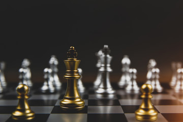The golden and the silver chess team on the chessboard Concept of business Strategic plan and teamwork management.