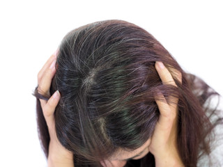 Young woman Serious and Stressed effected to headache and gray hair roots on white background