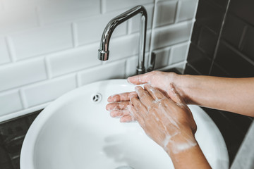 Asian woman washing with Soap hands thoroughly to Corona virus prevention