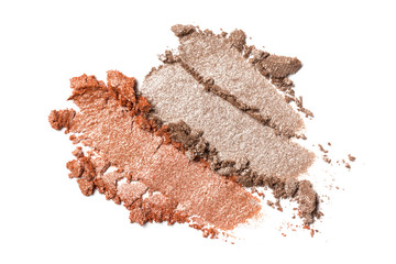 Close-up of make-up swatch. Smear of crushed brown and beige eye shadow