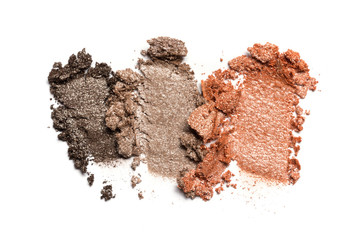 Close-up of make-up swatch. Smear of crushed brown and gray set eye shadow