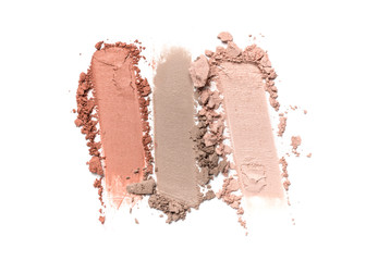Close-up of make-up swatch. Smear of crushed beige and brown eye shadow foundation
