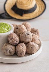 Local Canary Islands dish, Papas Arrugadas (wrinkly potatoes) with Mojo Verde (green sauce).
