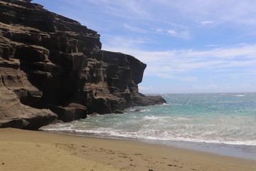 Green Sand Beach on Big Island in Hawaii on a sunny day