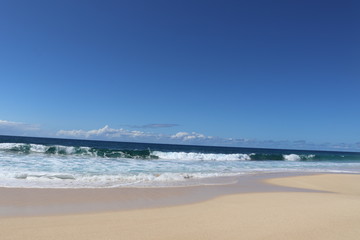 Fototapeta na wymiar The Banzai Pipeline surf reef break located in Hawaii at Ehukai Beach Park in Pupukea on Oahu North Shore