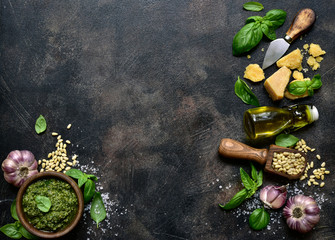 Delicious homemade basil pesto - traditional italian sauce. Top view with copy space.