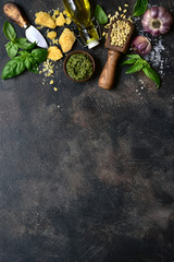 Delicious homemade basil pesto - traditional italian sauce. Top view with copy space.