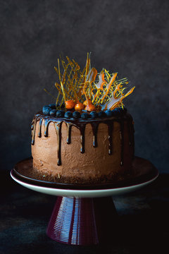 Homemade chocolate cake decorated with caramel decorations. Selective focus